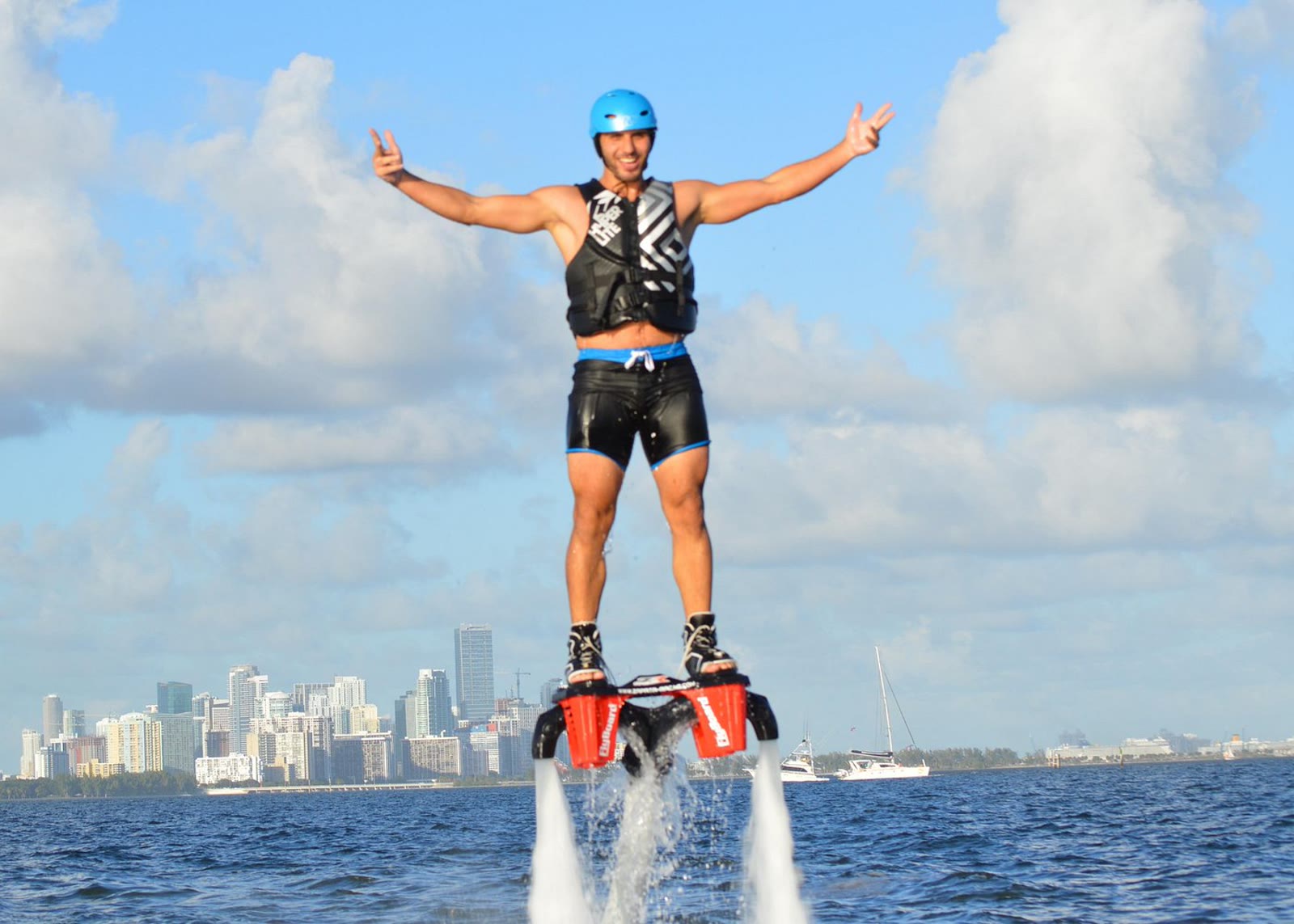 Flyboarding over Biscayne Bay with the Miami skyline behind
